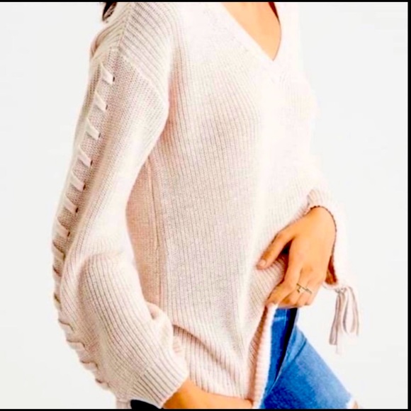American Eagle Outfitters Sweaters - White cream sweater with ties up the sleeves